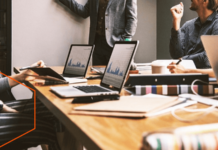 How to Know if Your Company Needs Fractional CMO Service? Business analytics with people in a meeting room