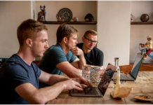 The Future of Work: 5 Ways Technology Can Improve Your Team’s Problem-Solving Skills People Discussing at Table